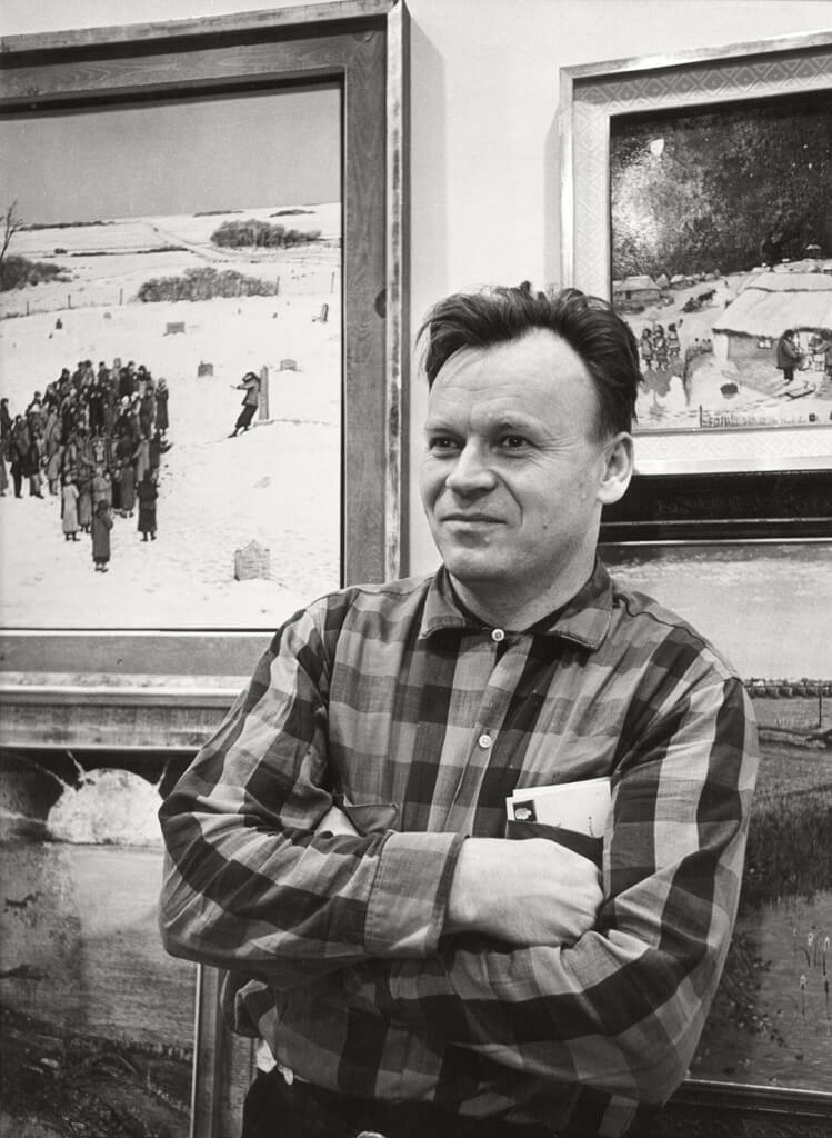 Art Canada Institute, William Kurelek, William Kurelek posing before his paintings, 1966.