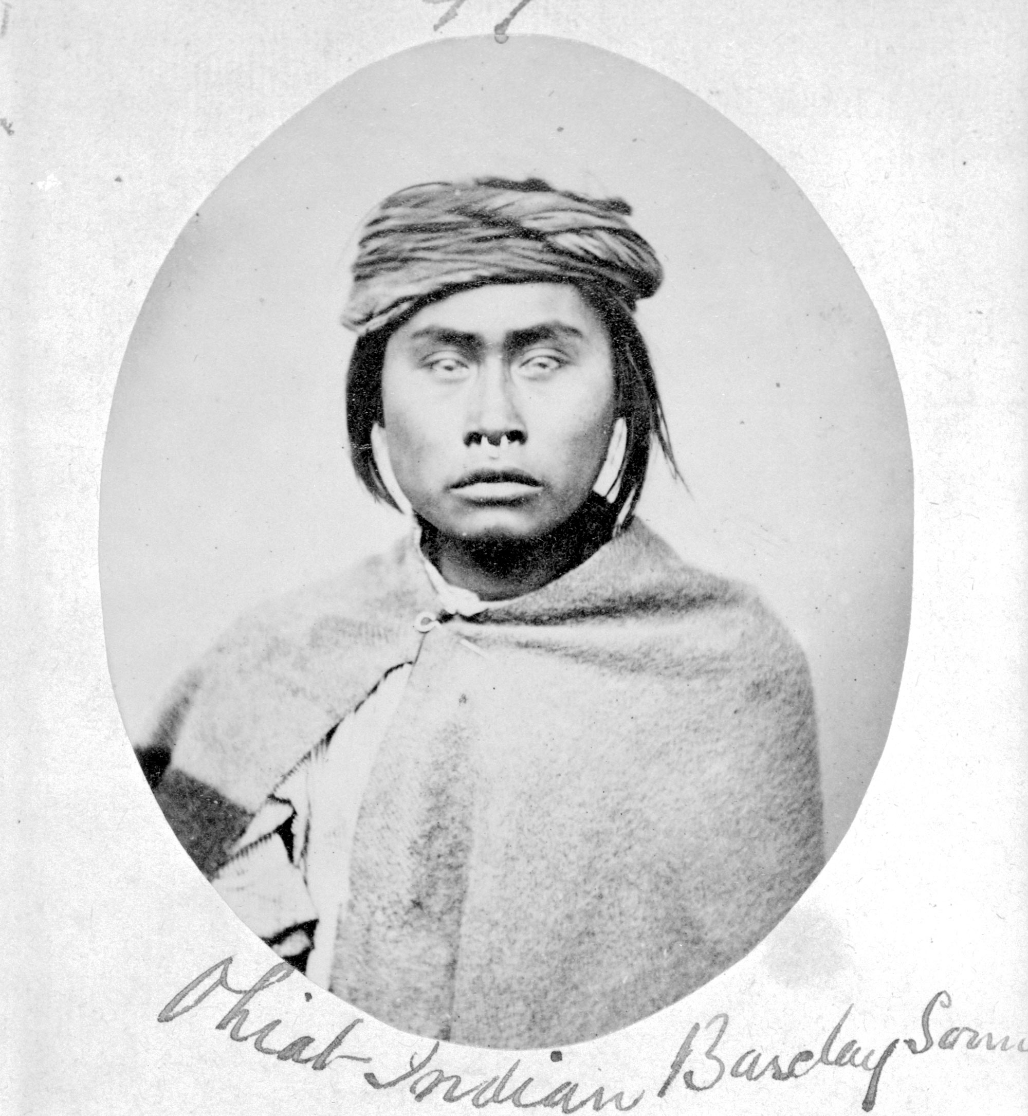A circular portrait photo of an Ohiat man.