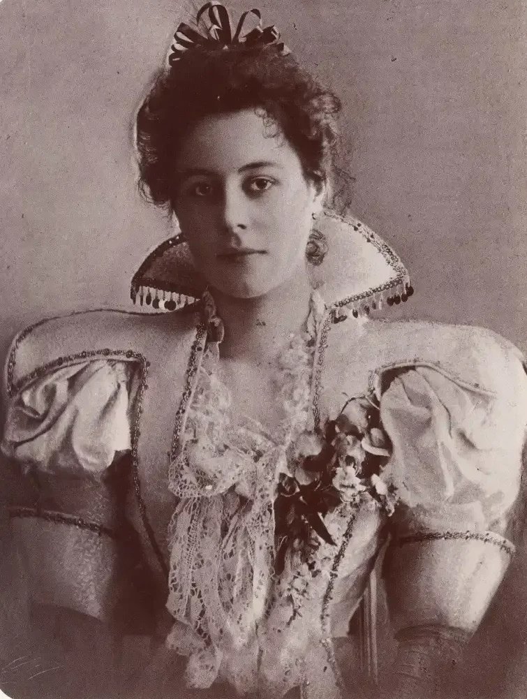 A photographic portrait of a young girl with text above.