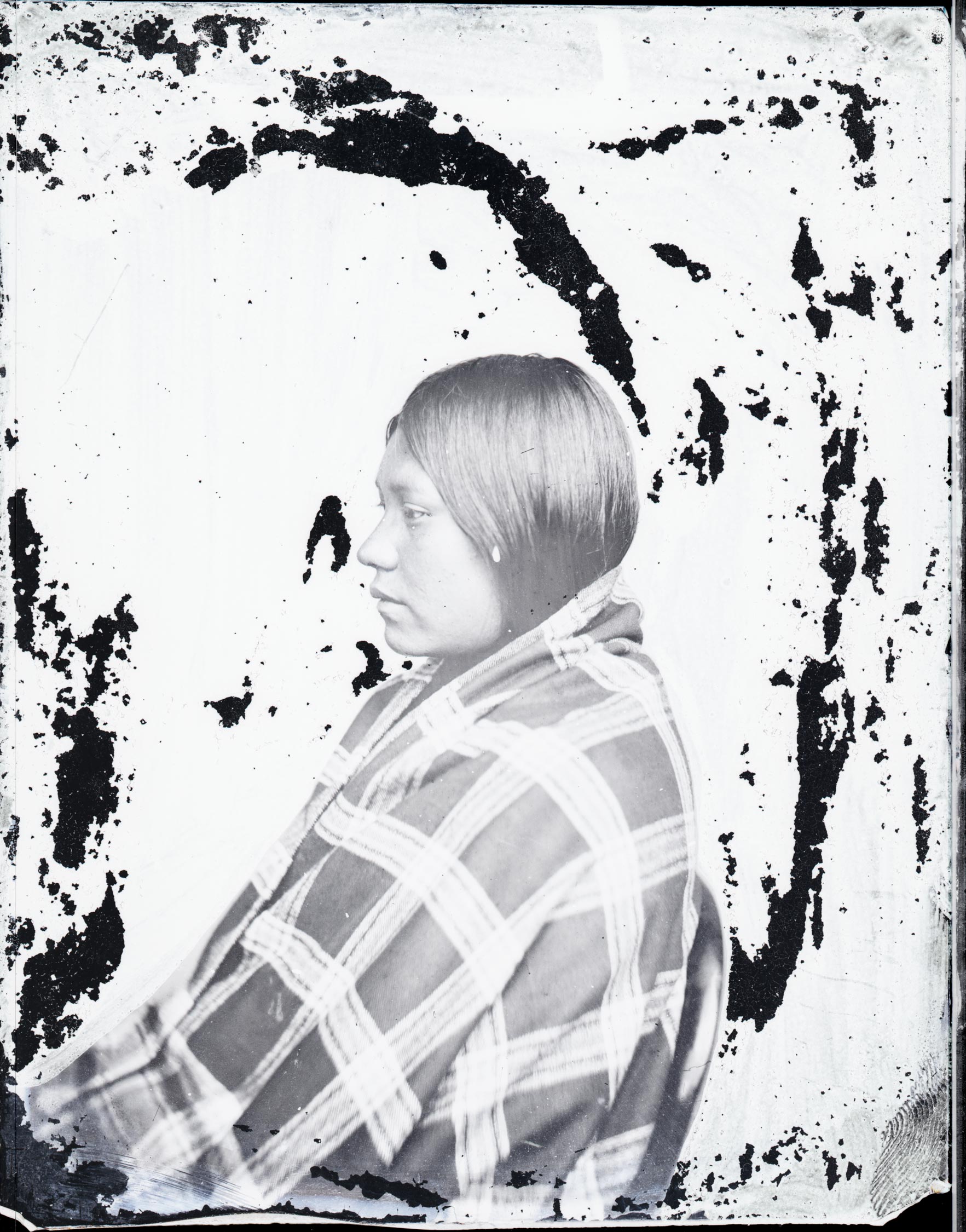 A photograph of a woman in profile.