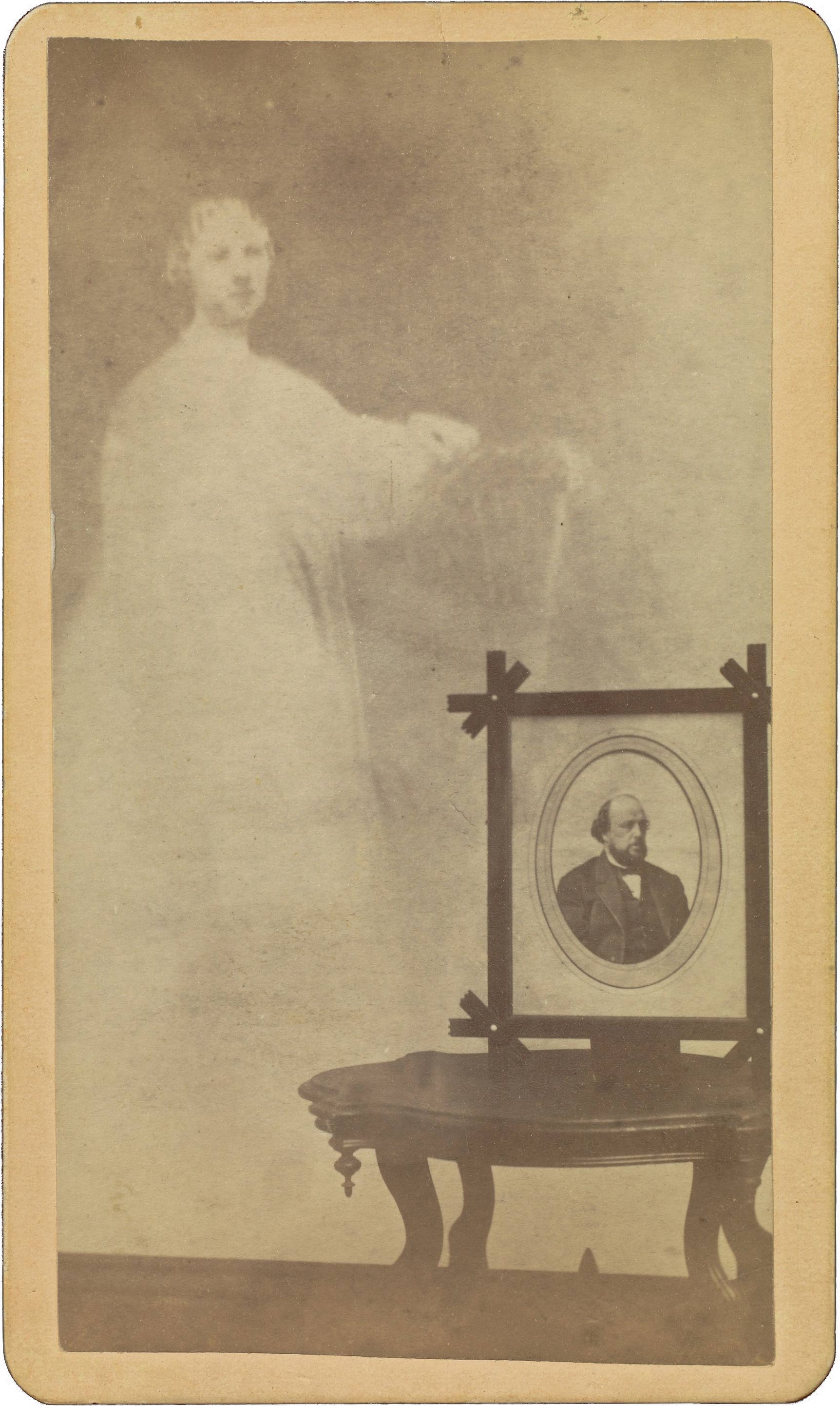 A sepia toned photograph of a spirit figure next to a portrait.