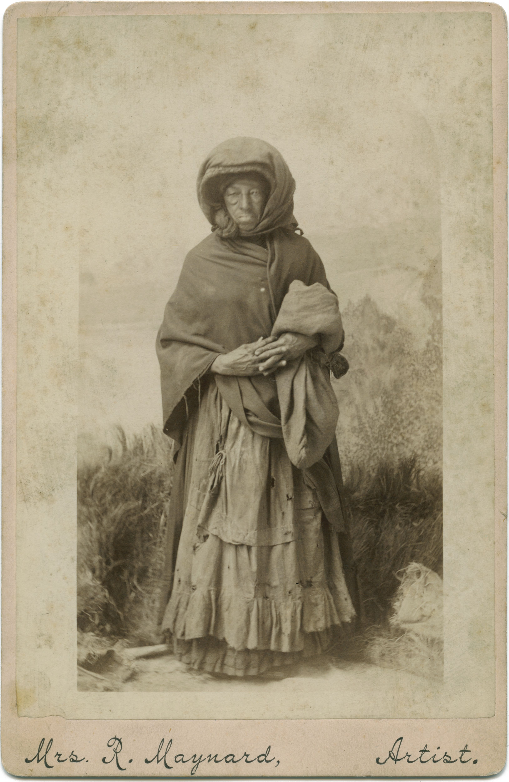 A sepia toned photograph of a woman standing.